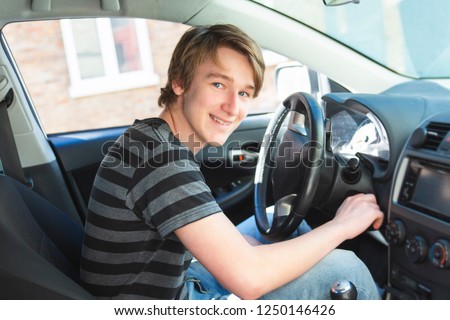 Stockfoto: Teenage Boy And New Driver Behind Wheel Of His Car