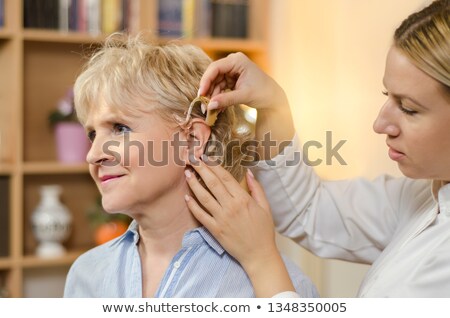 Stockfoto: Beautiful Young Woman With Hearing Aid