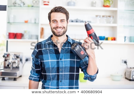 Stock photo: Portrait Of A Young Man With Drill