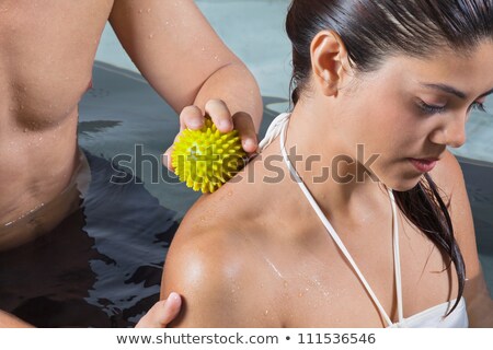 Foto stock: Woman Receiving Back Massage By The Pool