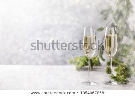 Foto stock: Christmas Ornaments And Champagne Glasses On Snow