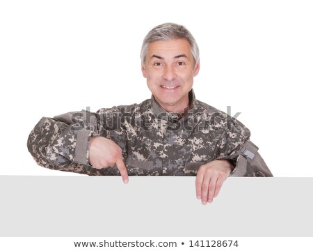 Zdjęcia stock: Mature Soldier Showing On Blank Placard