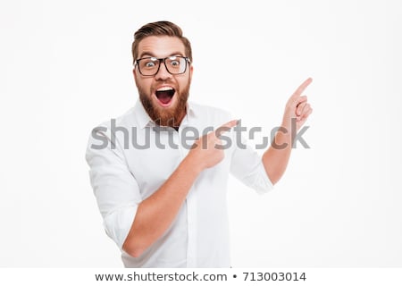 [[stock_photo]]: A Young Bearded Man Smiling With A Fingers Up Isolated On White