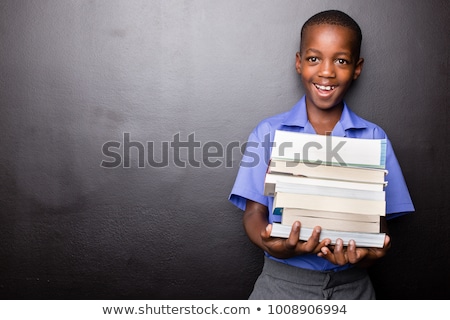 Stockfoto: A Boy Wearing A Green Uniform