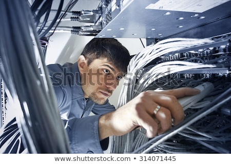 ストックフォト: Technician Checking Servers Wires In Data Center