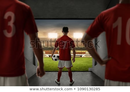 Foto d'archivio: Football Player Standing With Soccer In The Ground