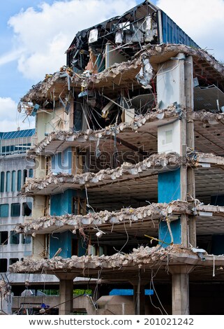 Stock fotó: Pieces Of Metal And Stone Are Crumbling From Demolished Building