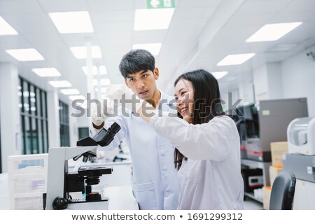 [[stock_photo]]: Two Scientists Working In The Chemical Lab