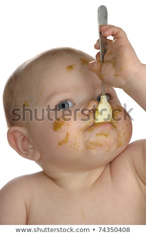 Imagine de stoc: Adorable Baby Girl Making A Mess While Feeding Herself