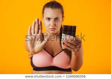 ストックフォト: Image Of Strong Overweight Woman In Tracksuit Doing Stop Gesture