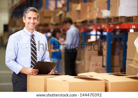 Сток-фото: Happy Businessman At Warehouse