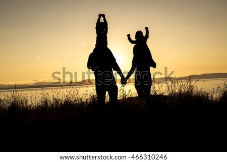 Family Of Four At Sunset Shadow Black Backlit Foto d'archivio © Lopolo