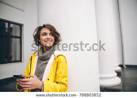 Stock photo: Happy Young Woman Dressed In Autumn Coat