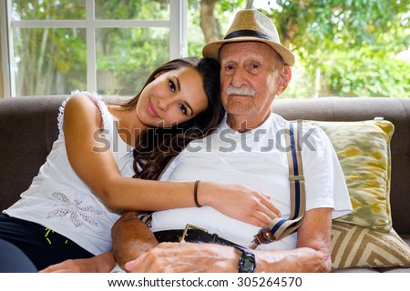 Stock photo: Portrait Of An Old Man Eighty Years With Granddaughter