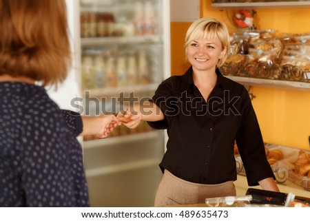 ストックフォト: Female Bakery Worker With Business Card