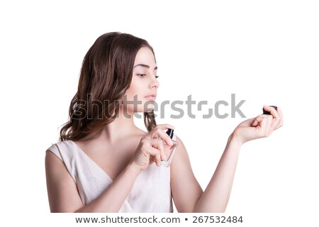 Woman Spraying Perfume On Her Neck Zdjęcia stock © Julenochek