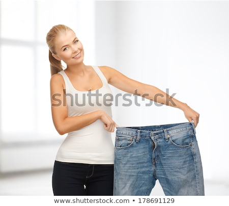 Stockfoto: Sporty Woman Showing Big Pants