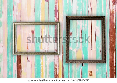 ストックフォト: Two Frames Of Picture On A Striped Old Wall