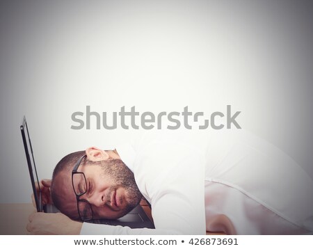 Foto stock: Exhausted Businessman Sleeping On His Laptop