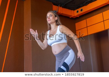 [[stock_photo]]: Closeup Shot Of Young Woman Making Exercise At The Gym