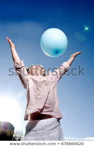Stock photo: 3 Years Old Girl Throwing A Balloon
