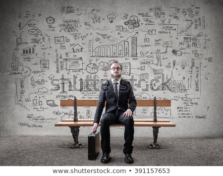 Foto stock: Businessman Sitting On Bench Waiting