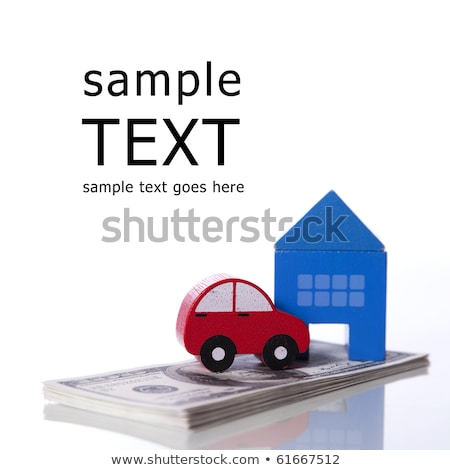 ストックフォト: Toy Cars Over A Lot Of Dollar Bills Isolated On White