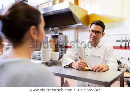 Zdjęcia stock: Chef At Fast Food Restaurant Writing Order