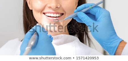 Stockfoto: Woman Teeth With Dental Instruments