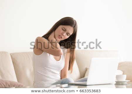 Foto stock: Pretty Young Woman With Stiff Neck Suffering From Back Pain