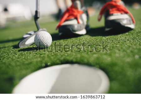 Kids Play Mini Golf Close Up Image Of Player In Snickers Stockfoto © matimix