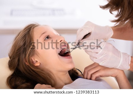 Stock photo: Girl Going Through Dental Treatment