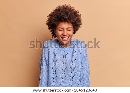 Stock photo: Pretty Blue Eyed Female With Cheerful Expression Giggles And Covers Mouth With Hand Expresses Happ