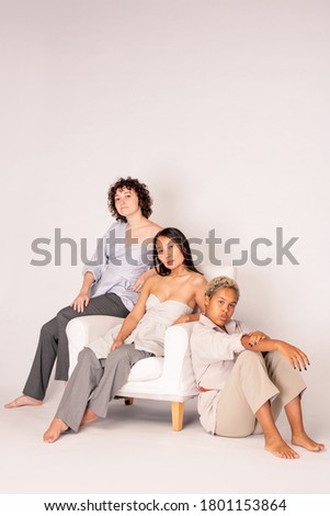 Father Mother And Daughter Sit In Leather Armchair Сток-фото © Pressmaster