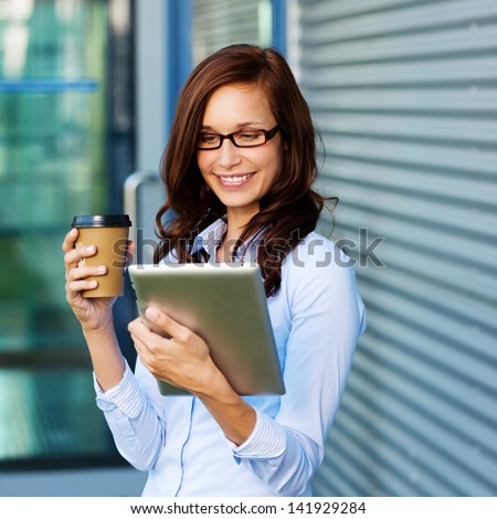 Stockfoto: Pretty Young Woman With Digital Tablet By The Office Building