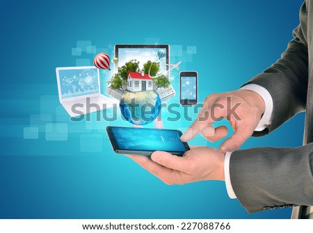 Man Holding Tablet Near The Earth And Electronics [[stock_photo]] © cherezoff