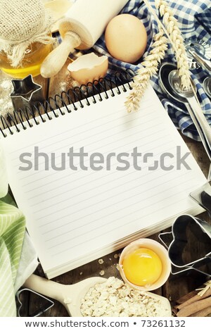 Foto stock: Open Notebook And Basic Baking Ingredients