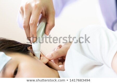 Stock foto: Doctor Placing Her Hand On A Patients Forehead