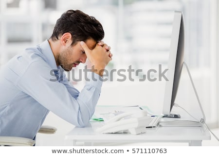 [[stock_photo]]: Frustrated Businessman Sitting At Desk In Office