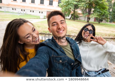 Foto stock: Cheerful Students Taking Selfies