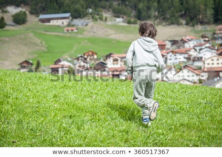 [[stock_photo]]: Kid Enjoying Swiss Coutryside In Idyllic Alps