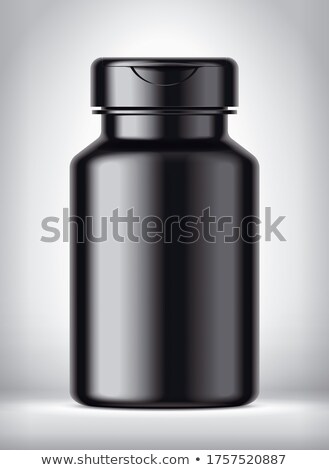 Foto stock: Dark Bottle With Capsules On Dark Background