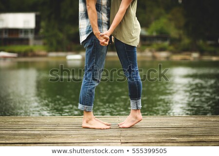 Stockfoto: Couple On A Dock Smiling And Relaxing