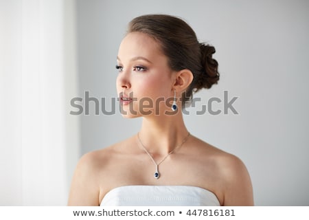 Foto stock: Beautiful Asian Woman With Earring And Pendant