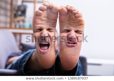 Stockfoto: Feet With Painful Facial Expression