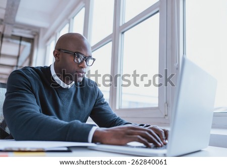 [[stock_photo]]: African American Businessman With Laptop At Office