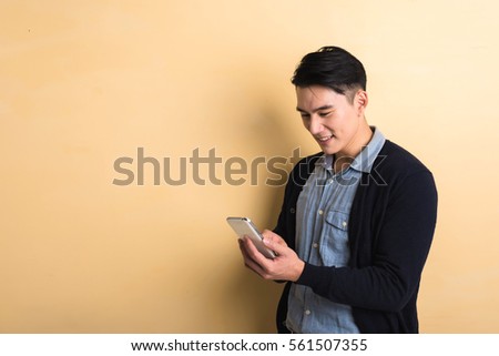 Handsome Young Man Using A Mobile Phone With Copyspace Foto d'archivio © elwynn