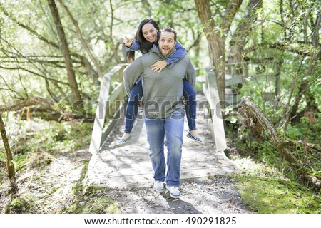 Foto stock: Nice Couple Having Good Time In The Forest