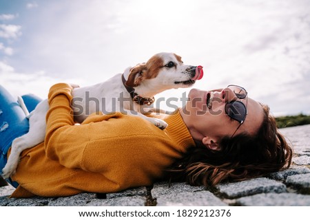 Stock photo: Woman With Terrier Dog Outside At The Park