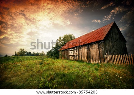Ancienne grange avec de l'herbe et ciel bleu [[stock_photo]] © johnnychaos